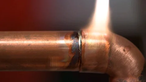 Soldering a pipe Stock Footage 95541627