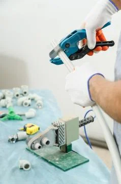 Soldering plastic pipe. Stock Photos