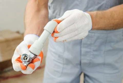 Soldering plastic pipe. Stock Photos