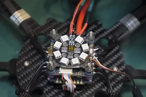 Soldering the power wires to drone controller board Stock Photos
