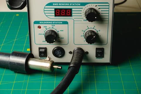 Soldering station setup for intricate electronics work in a cozy workshop Stock Photos