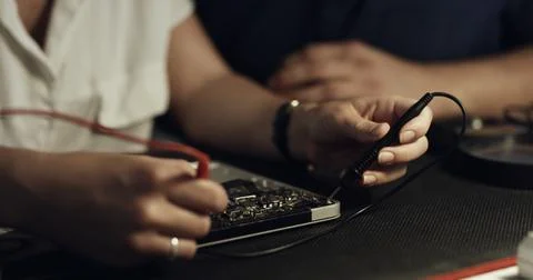 Soldering, team or hands in workshop with circuit board, guidance or wiring.. 스톡 사진