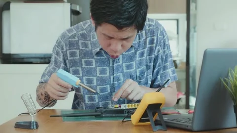 Soldering Technique Demonstration at Workbench Stock Footage 314995910