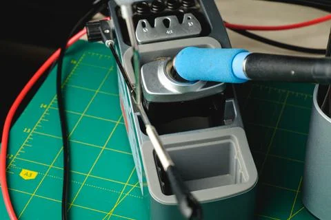 Soldering tool on workspace with cables and precision instruments ready for use Stock Photos