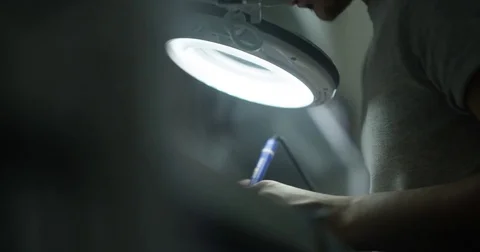 Soldering under a microscope Stock Footage 76228632