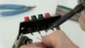 Soldering wire to speaker terminals HD Footage