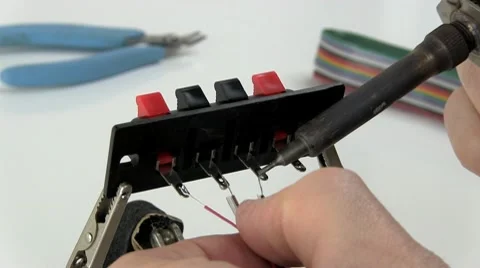 Soldering wire to speaker terminals Stock Footage 10588981