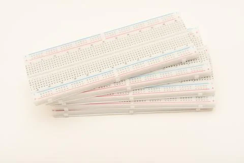 A solderless board for electronics. A breadboard for experiments in electro.. Stock Photos