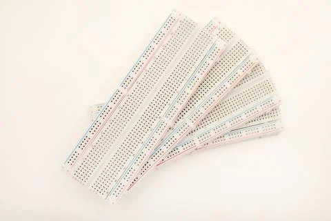 A solderless board for electronics. A breadboard for experiments in electro.. Stock Photos