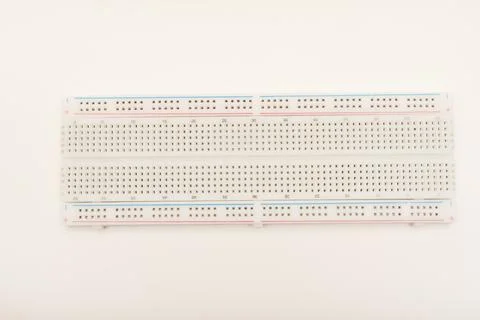 A solderless board for electronics. A breadboard for experiments in electro.. Stock Photos