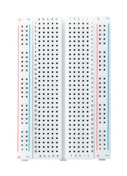 Solderless breadboard, universal prototyping perfboard isolated from above Stock Photos