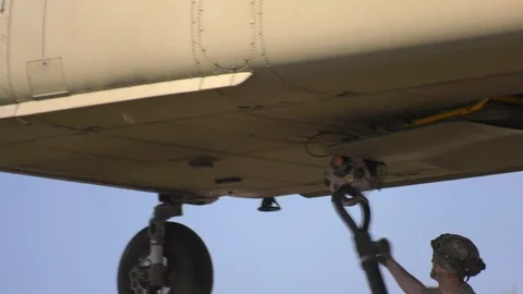 Soldier attaching hook to CH-47 Chinook during sling load operations Stock Footage 105289432