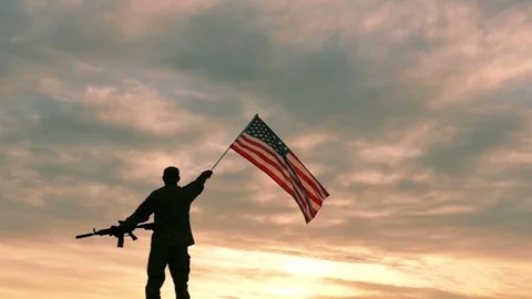 Soldier with automatic rifle wave American Flag .Slow Motion.  Video stock 70056987