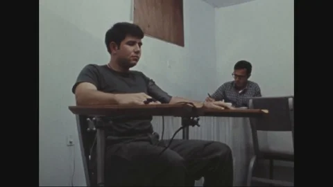 Soldier being given a lie detector test in polygraph examination room - 1972 Stock Footage 97906551