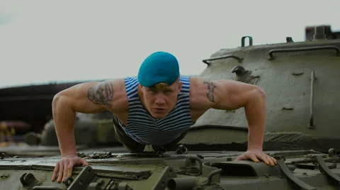 A soldier in a blue beret doing push-ups Stock Footage 64539772