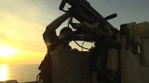 Soldier cleaning machine gun aboard LSV5 Maj Gen Charles P Gross Stock Footage 104855400