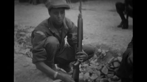 Soldier cleaning the rifle Stock Footage 36300876