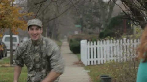 Soldier coming home and hugging his wife Stock Footage