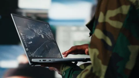 Soldier in command center housing missile defense system using laptop, closeup Stock Footage 318855235