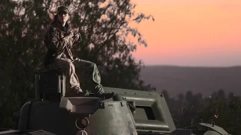 Soldier on the commander's hatch of a tank Stock Footage 157738922