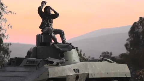 Soldier on the commander's hatch of a tank Stock Footage 157738999