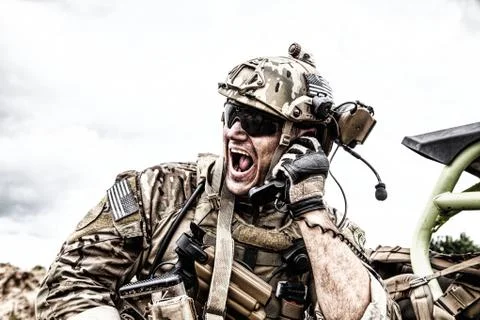 Soldier communicating with command during battle Stock Photos