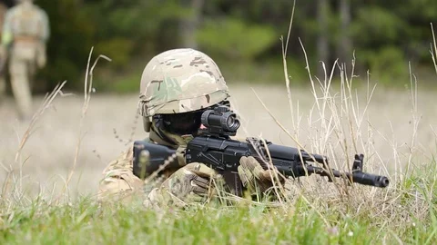 Soldier during combat operations. helmet, mask, glasses. watching the enemy Stock Footage 127753536