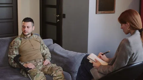 Soldier engages in therapy session to address mental health challenges and Stock Footage 321432185