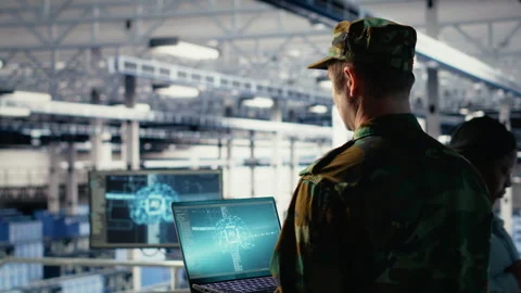 Soldier in engineering role uses AI on laptop to manage server hub systems Stock Footage 314804293