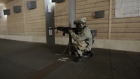 A soldier on the exercise are running and firing from automatic weapons Stock Footage 82790157