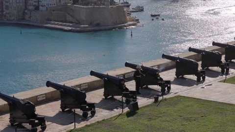 Soldier fire canon facing sea harbor with lot of smoke on sunny day Stock Footage