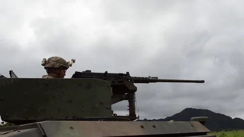 Soldier fires from M2 machine gun while on M115A1 HMWVVs - 2017 Stock Footage 84951129