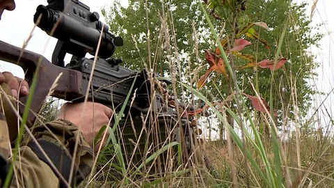 The soldier fires a machine gun Video stock 80881617