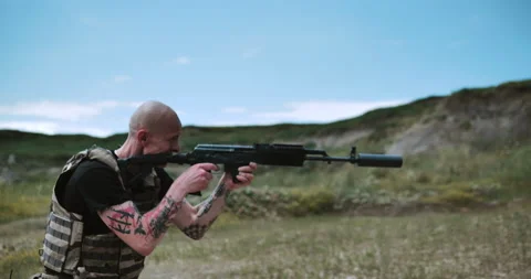 A soldier fires a machine gun Video stock 134386742