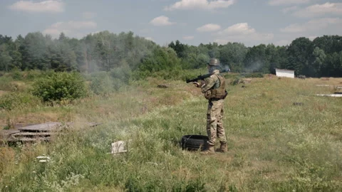 Soldier fires a Precision Shoulder-Fired Rocket Launcher RPG-7 PSRL-1 at his Stock Footage 205518662