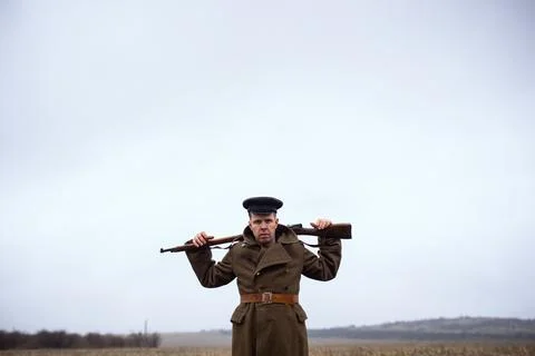 Soldier first world war boldly holds weapon around his neck looks evilly Stock Photos