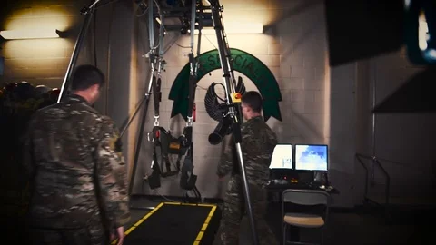 Soldier fitting and securing virtual reality harness for survival training Stock Footage 103310669
