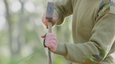Soldier hammering pole into ground Stock Footage 77015035