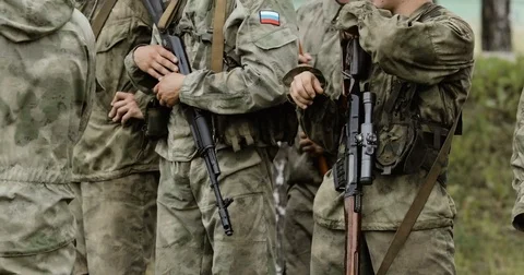 Soldier hand holding automatic machine gun. Soldier with assault rifle in hand. Stock Footage 78585781