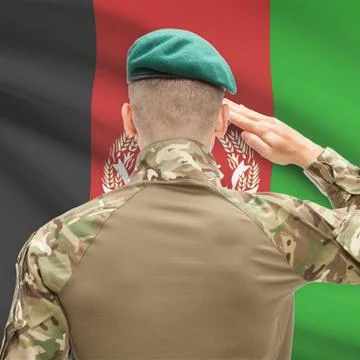 Soldier in hat facing national flag series - Afghanistan Foto stock