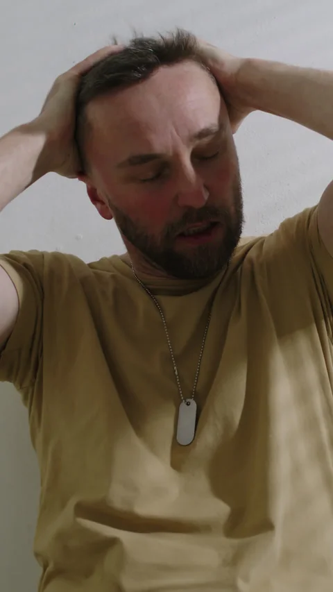 Soldier Having Panic Attack from PTSD, Screaming and Holding his Head in Hands Stock Footage 293764322