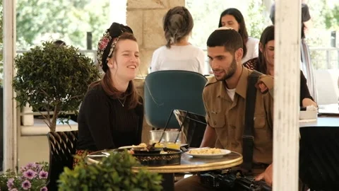 A soldier with his date. NTSC Stock Footage 206388221