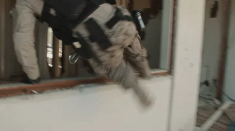 Soldier Jumping Through Window Stock Footage 47922957