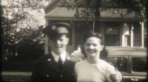 A soldier on leave hugs and kisses his girl 1940s vintage film home movie 1352 Stock Footage