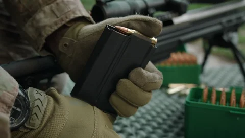 Soldier load ammo. Sniper. Slow Motion. 4K (UHD). Stock-Footage 107122018