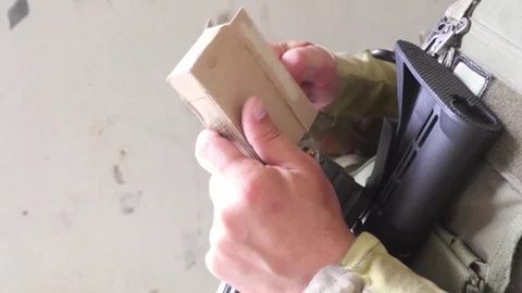 Soldier loading bullets into magazine 動画素材 93644136