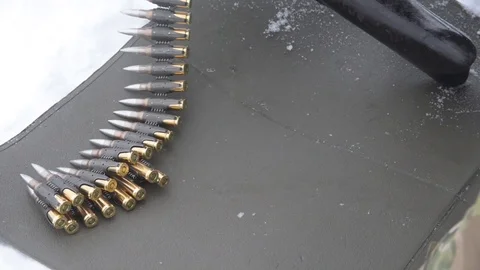 Soldier loading machine gun with ammunition Video stock 102830552