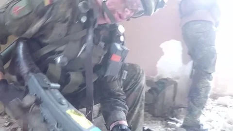 Soldier loading machine gun inside derelict building 動画素材 93390281