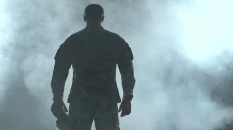 Soldier looking down, surrounded by smoke Vídeo Stock 11452297
