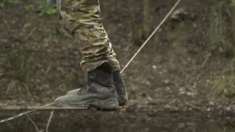 Soldier on low tight rope Stock Footage 77014035